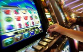 Multi-camera live-dealer broadcast showing cards, roulette wheel, and real-time bet settlement